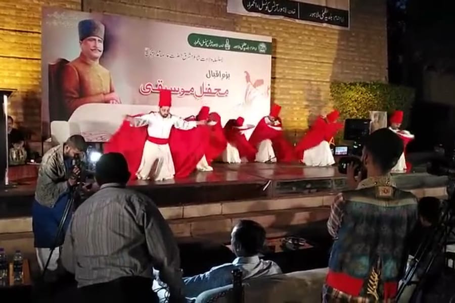 VPAG Sufi performance in warm low stage lighting